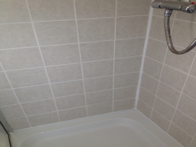 And, as you can see here the the tiles and grout look like New!